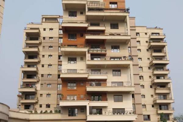 Front-facing view of Infinity Heights showing its geometric, multi-level architectural design.