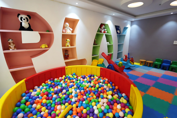 The vibrant indoor kids' play area (part of the clubhouse) at Infinity Heights, adding value to the Luxury Apartments in Guwahati.