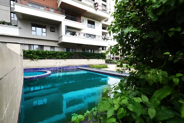 When searching for the best flat in Guwahati, look for a lifestyle, not just a home. At Infinity Heights, residents enjoy exclusive access to resort-style amenities like this pristine swimming pool—a perfect oasis to unwind and relax. Experience a life where luxury, comfort, and exceptional facilities come together to create an unparalleled living environment.