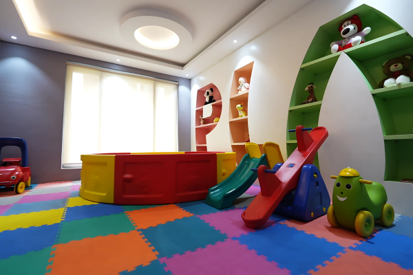 Step inside the vibrant Clubhouse at Infinity Heights, where your children's safety and happiness come first. Our dedicated indoor play area is a colorful haven, thoughtfully designed for endless fun, creativity, and cherished childhood memories. It's just one of the many family-friendly amenities that make life here so special.