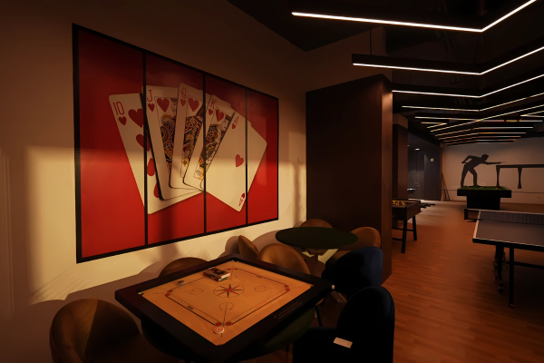 This image depicts another section of the indoor games and recreation area, highlighting a dedicated spot for board and table games, a great feature in Premium Flats in Guwahati. A carrom board is set up, surrounded by plush chairs, beneath a striking wall mural of playing cards. In the background, other games like table tennis are visible, all under contemporary strip lighting. This cozy, well-designed corner offers residents a sophisticated space for casual games and unwinding with neighbours and friends.