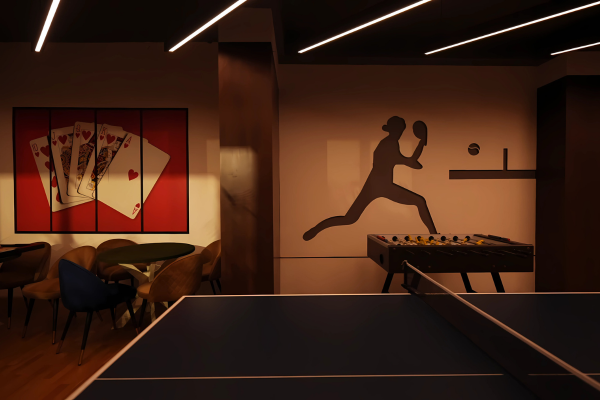 An interior shot of the game room, featuring a table tennis setup and foosball (a facility within the clubhouse) at Infinity Heights near the Luxury Apartments in Guwahati.