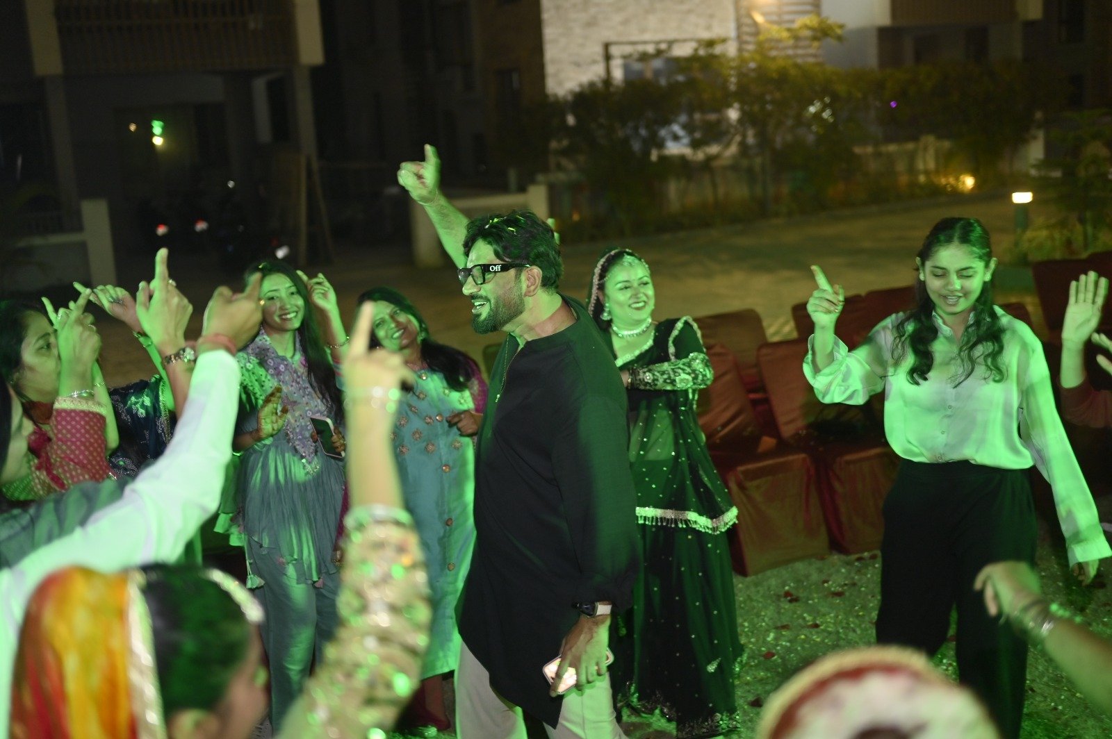 Vibrant 2026 Holi Dhamal at Infinity Heights Guwahati, featuring traditional dance and residents in ethnic wear near a luxury villa for sale in guwahati, celebrating community on the garden lawn.