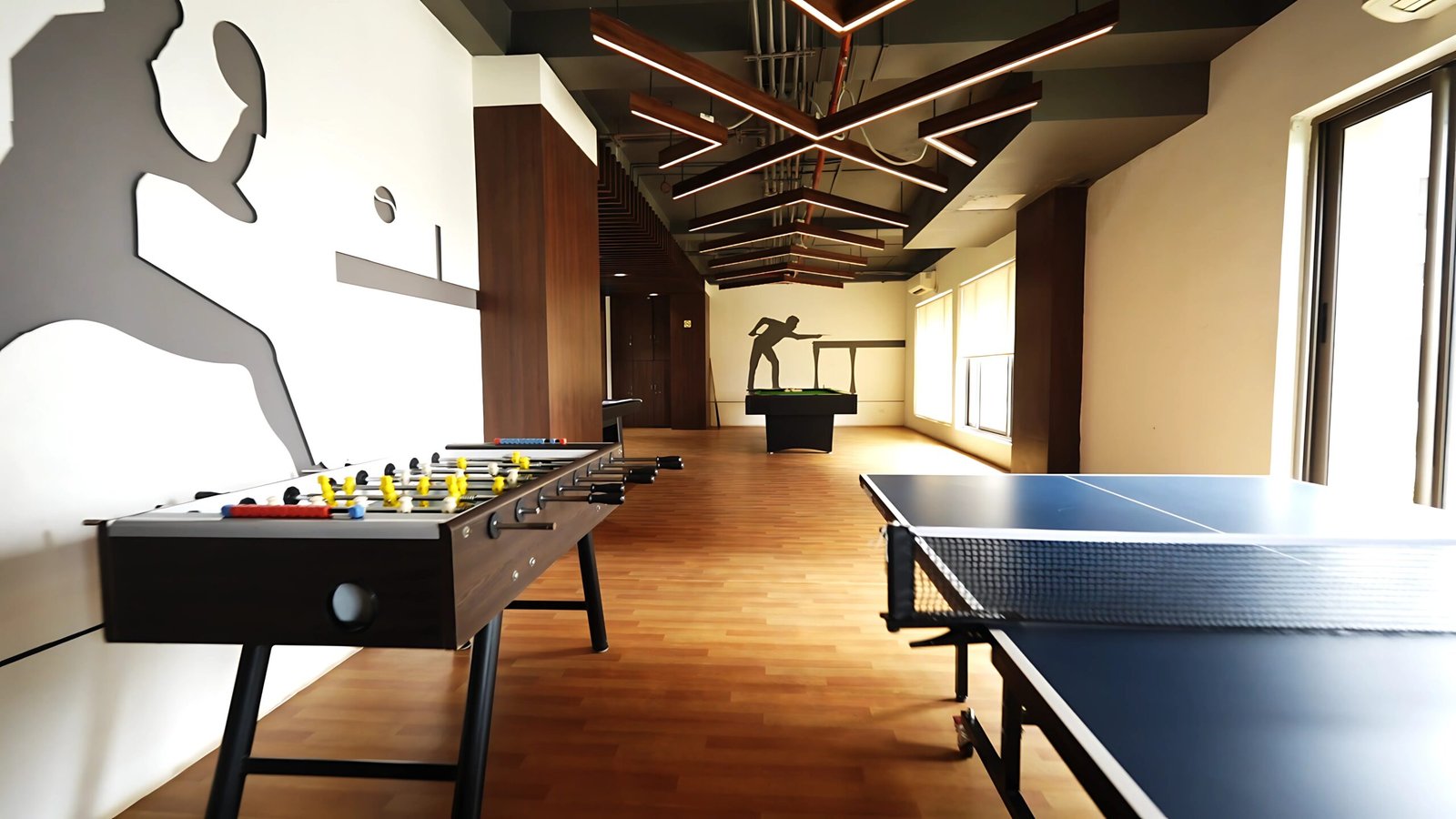 pool tabble, table tennis and carrom table present in games room