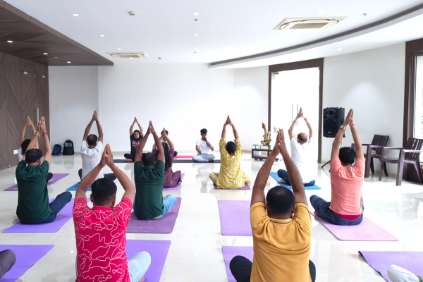 Residents of Infinity Heights doing Yoga on International Yoga Day