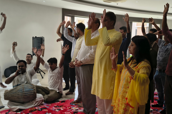 Residents gathered for kirtan and devotional chants during the Rath Yatra celebration at Infinity Heights apartment in Guwahati.