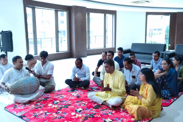 Community members participating in spiritual chants inside an Apartment in Guwahati.