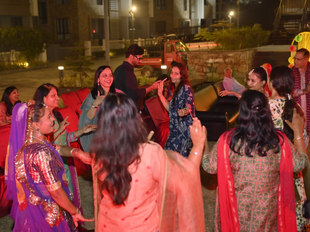 A vibrant group dance performance bringing residents together during the Holi festival event at Infinity Heights.