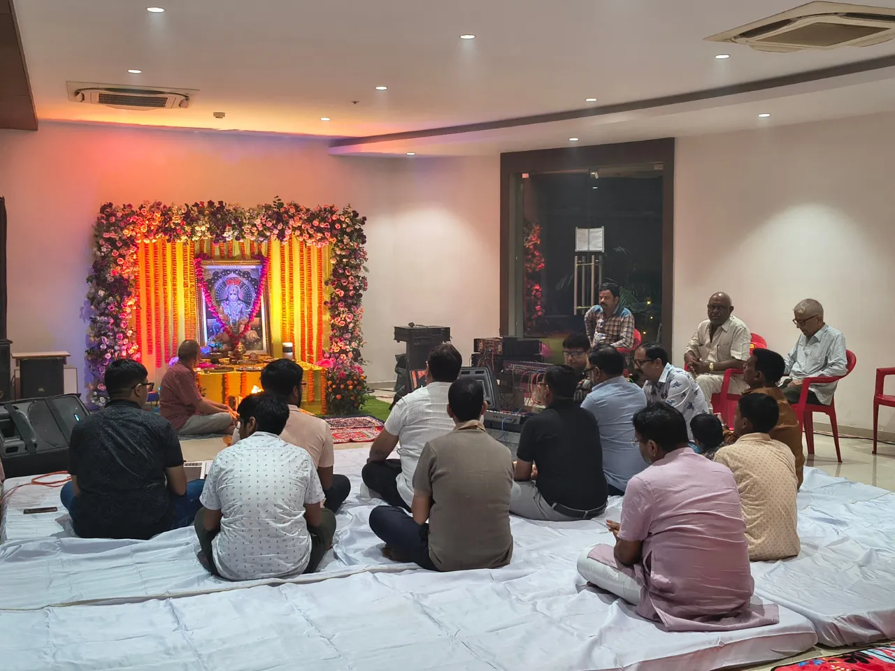 Devotees gathered in the multipurpose banquet hall for bhajan sandhya at Infinity Heights luxury apartment in Guwahati
