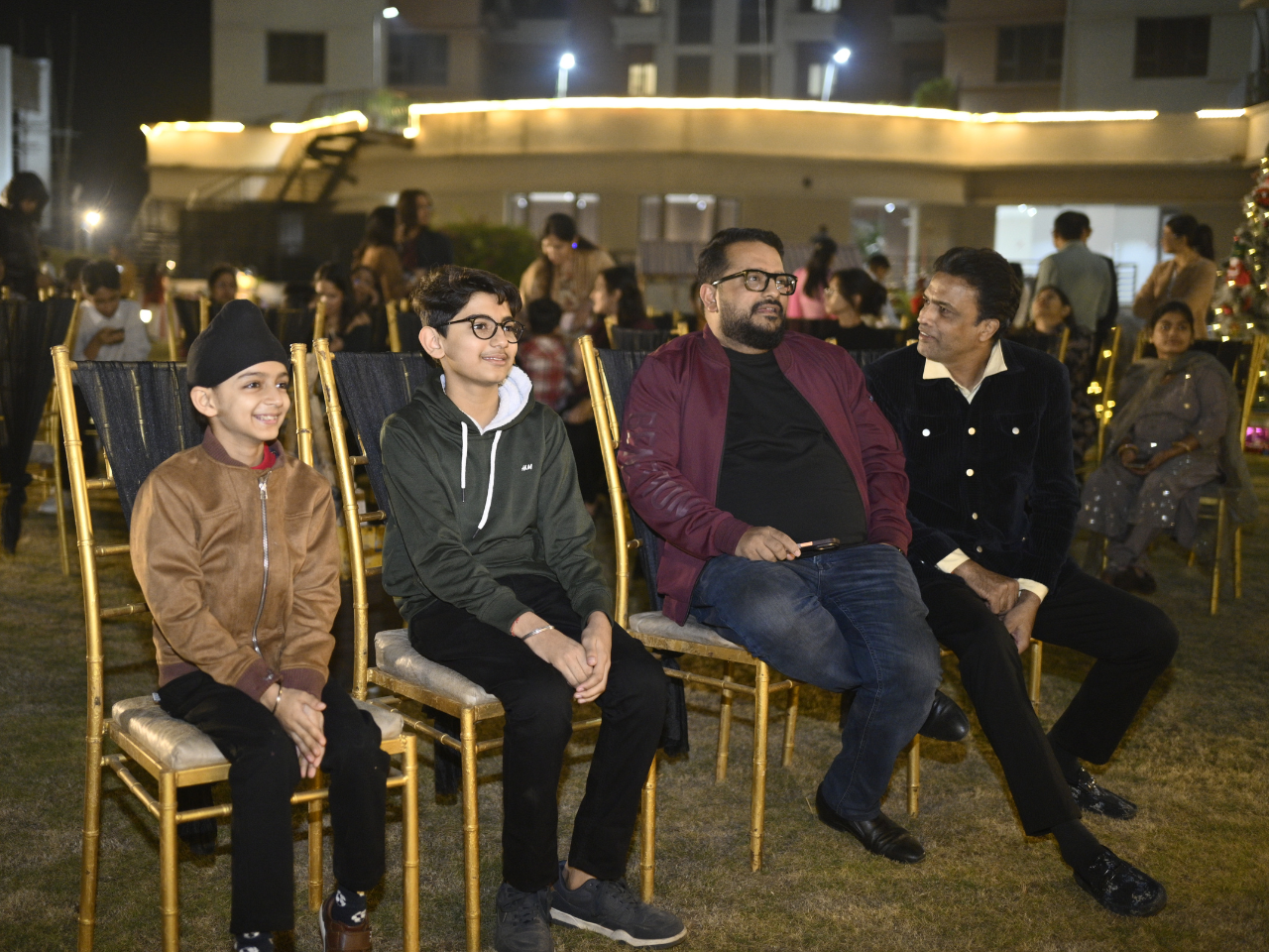 Residents relaxing and watching the holiday program during the winter celebrations at Infinity Heights, a luxury apartment in Guwahati.