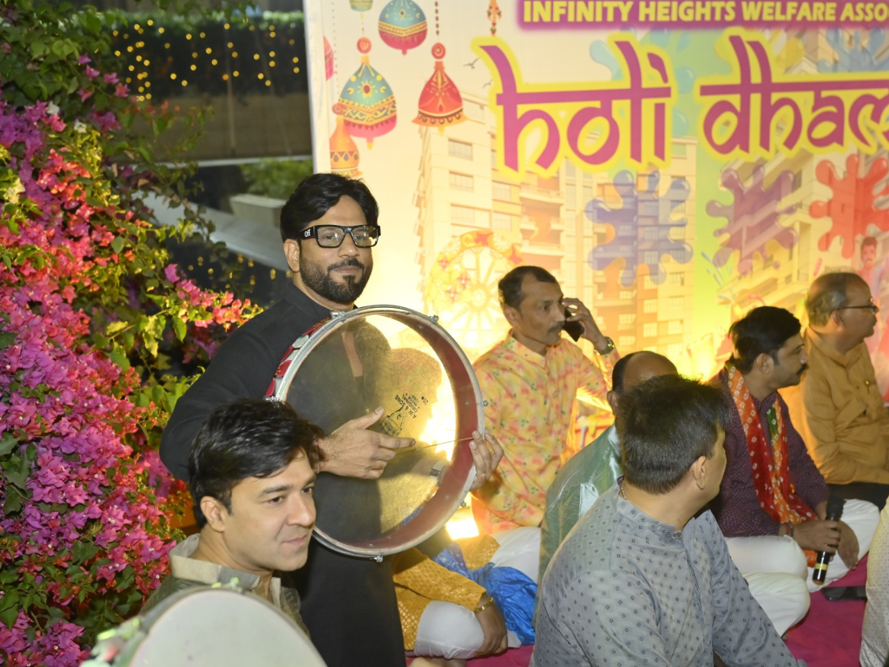 Musicians playing traditional Indian drums at the Holi Dhamaka event at Infinity Heights, a premium apartment in Guwahati.