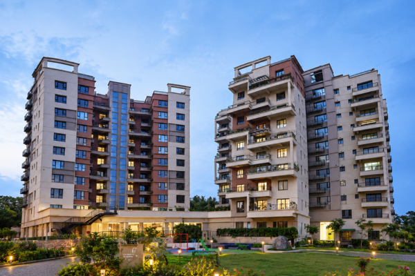 Modern residential apartments surrounded by landscaped gardens showcasing property in Guwahati
