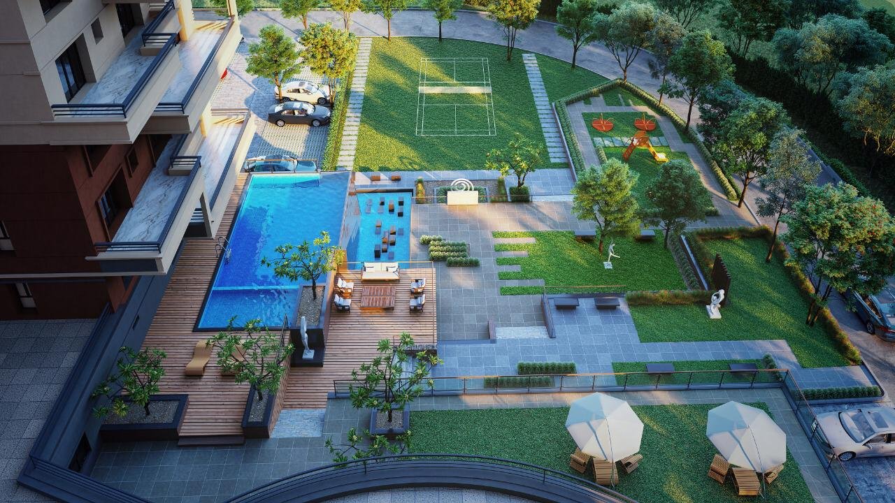 Premium flats in Guwahati with a landscaped courtyard, swimming pool and sports area.